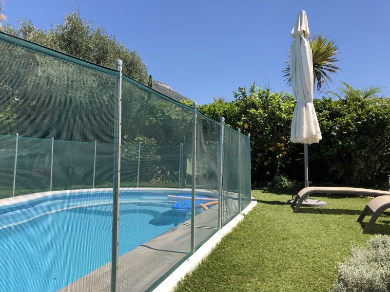 Mesh Fence Secured at Pool Edge